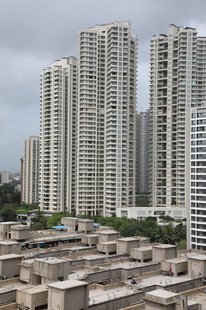 home-services-02 Aerial view of tall residential skyscrapers in a busy urban environment.